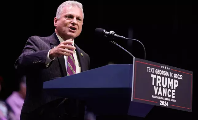 FILE - Rep. Buddy Carter, R-Ga., speaks before Republican presidential candidate former President Donald Trump arrives to deliver remarks on the tax code, and manufacturing at the Johnny Mercer Theatre Civic Center, Sept. 24, 2024, in Savannah, Ga. (AP Photo/Evan Vucci, File)