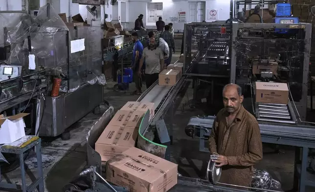 Employees of the Murree Brewery work in a liquor production unit of the factory, in Rawalpindi, Pakistan, Monday, June 23, 2025. (AP Photo/Anjum Naveed)