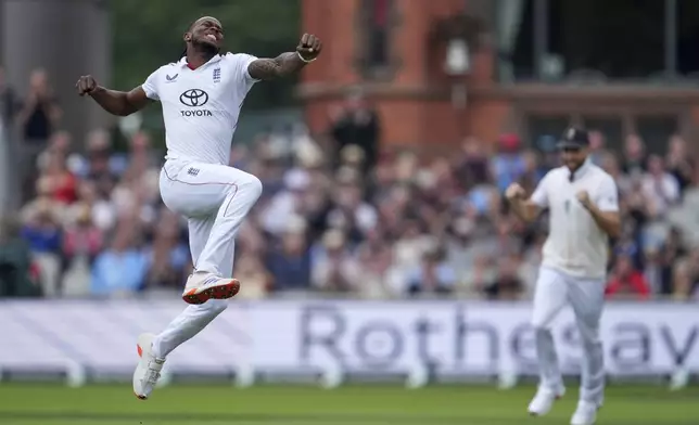 England's Jofra Archer celebrates the dismissal of India's Ravindra Jadeja during the second day of the fourth cricket test match between England and India at Emirates Old Trafford, Manchester, England, Thursday, July 24, 2025. (AP Photo/Jon Super)