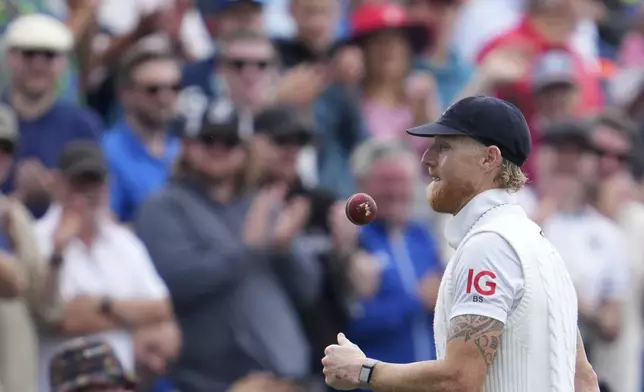 England's captain Ben Stokes toss a ball as he returns to pavilion after India's inning during the second day of the fourth cricket test match between England and India at Emirates Old Trafford, Manchester, England, Thursday, July 24, 2025. (AP Photo/Jon Super)