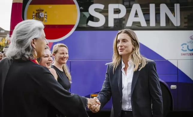 Spain's Alexia Putellas, right, of the women's national football team is welcomed by the Spanish Ambassador to Switzerland Maria Celsa Nuno Garcia at the Royal Savoy hotel in Lausanne, Switzerland, on the sidelines of the UEFA Women's Euro 2025, Sunday, June 29, 2025. (Gabriel Monnet/Keystone via AP)