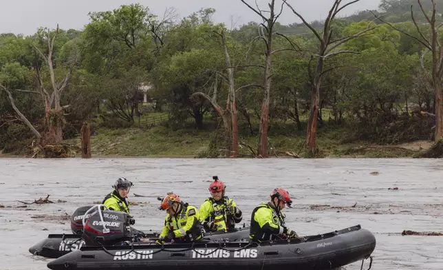 Members of Task Force 1 deploy boats along the Guadalupe River in the wake of a destructive flooding event in Kerrville on Friday July 4, 2025. (Christopher Lee/The San Antonio Express-News via AP)
