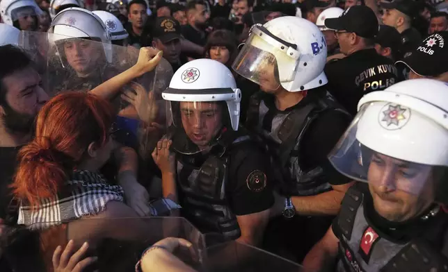 University students scuffle with police during a protest called by the main opposition Republican People's Party or (CHP), in Istanbul, Turkey, Tuesday, July 1, 2025. (AP Photo/Francisco Seco)