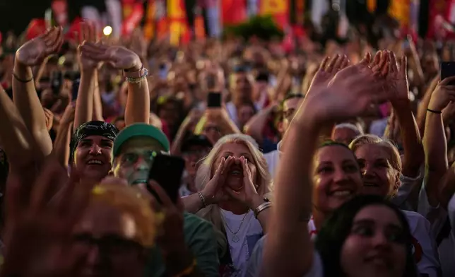 People chant slogans during a protest called by main opposition Republican People's Party or (CHP), outside the City Hall in Istanbul, Turkey, Tuesday, July 1, 2025. (AP Photo/Khalil Hamra)