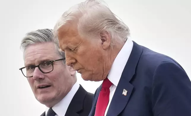 President Donald Trump and Britain's Prime Minister Keir Starmer exit Air Force One as they arrive at Royal Air Force Lossiemouth en route to Aberdeen, Scotland Monday, July 28, 2025. (AP Photo/Jacquelyn Martin)