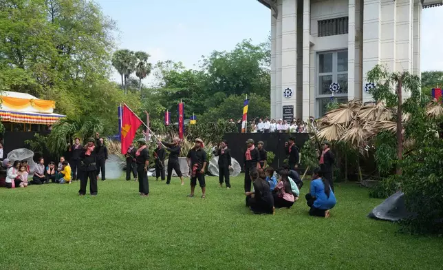 FILE - Cambodian students of Royal University of Fine Arts reenact torture and execution by the Khmer Rouge during their reign of terror in the 1970s, in an event hosted by the ruling Cambodian People's Party to mark the annual Day of Anger at Choeung Ek, a former Khmer Rouge "killing field," on the outskirt of Phnom Penh, Cambodia Wednesday, May 20, 2015. (AP Photo/Heng Sinith, File)