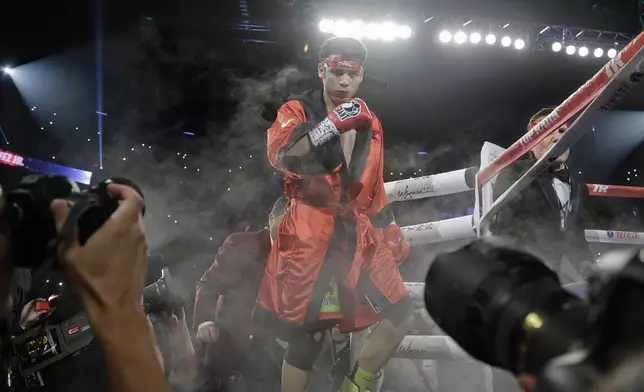FILE - Julio Cesar Chavez Jr. enters the ring before fighting Sergio Martinez for the WBC middleweight title fight, in Las Vegas, Sept. 15, 2012. (AP Photo/Julie Jacobson, File)