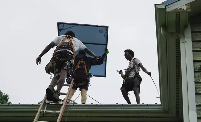 Solar panels are installed on a home in Chapel Hill, N.C., Wednesday, July 2, 2025. (AP Photo/Allen G. Breed)