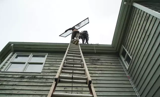 Solar panels are installed on a home in Chapel Hill, N.C., Wednesday, July 2, 2025. (AP Photo/Allen G. Breed)