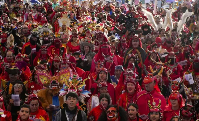 Diablito dancers take part in a celebration of the Virgen de Carmen or Our Lady of Mount Carmel, Chile's patron saint, in La Tirana, Chile, Monday, July 14, 2025. (AP Photo/Esteban Felix)