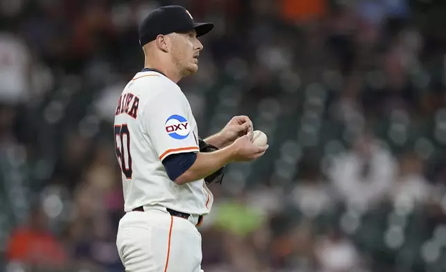 Houston Astros starting pitcher Brandon Walter looks the outfield after giving up a home run to Cleveland Guardians' José Ramírez during the first inning of a baseball game Wednesday, July 9, 2025, in Houston. (AP Photo/David J. Phillip)
