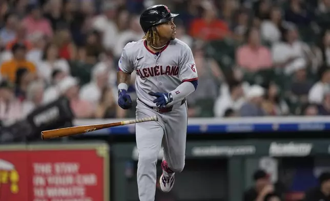 Cleveland Guardians' José Ramírez watches his home run against the Houston Astros during the first inning of a baseball game Wednesday, July 9, 2025, in Houston. (AP Photo/David J. Phillip)