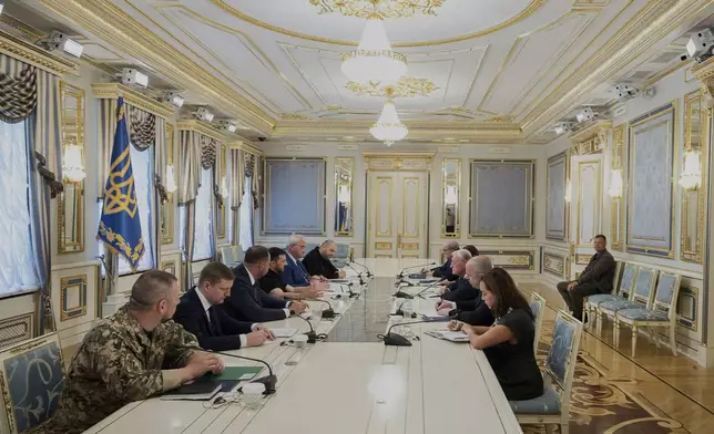 In this photo provided by the Ukrainian Presidential Press Office, Ukrainian President Volodymyr Zelenskyy, center left, and United States Special Envoy for Ukraine and Russia, Joseph Keith Kellogg, center right, speak during a meeting, in Kyiv, Ukraine, Monday, July 14, 2025. (Ukrainian Presidential Press Office via AP)