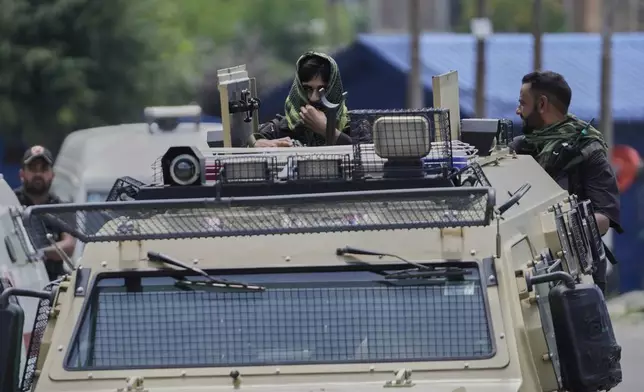 Jammu and Kashmir Special Operation Group (SOG) personnel arrive near the site of a gun battle on the outskirts of Srinagar, Indian controlled Kashmir, Monday, July 28, 2025. (AP Photo/Mukhtar Khan)