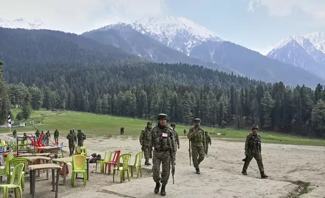 FILE - Indian security officers inspect the site where militants indiscriminately opened fired on tourists the previous day, in Pahalgam, Indian controlled Kashmir, April 23, 2025. (AP Photo, File)