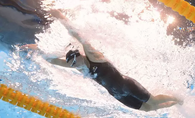 Summer McIntosh of Canada competes in the women's 200-meter individual medley final at the World Aquatics Championships in Singapore, Monday, July 28, 2025. (AP Photo/Lee Jin-man)
