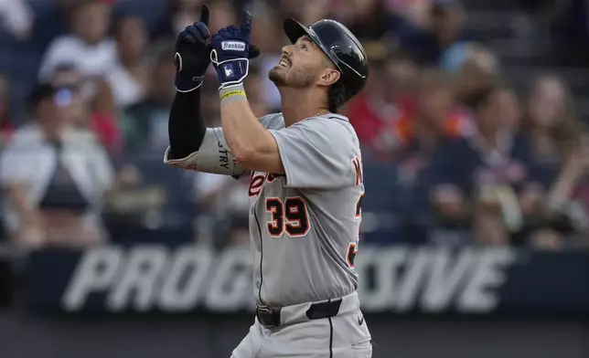 Detroit Tigers' Zach McKinstry gestures as he runs to home plate with a home run in the fourth inning of a baseball game against the Cleveland Guardians in Cleveland, Friday, July 4, 2025. (AP Photo/Sue Ogrocki)