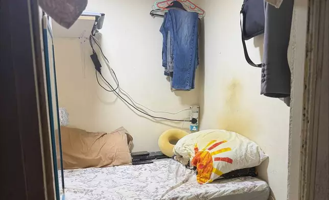 A modified closet where a migrant worker lives in Dubai, United Arab Emirates, is seen on Tuesday, July 8, 2025. (AP Photo/Gabe Levin)