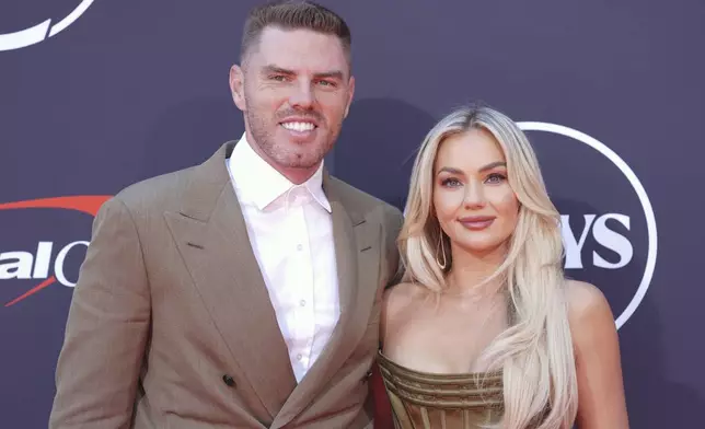 Freddie Freeman, left, and his wife, Chelsea, arrive at the ESPY Awards at the Dolby Theatre in Los Angeles, Wednesday, July 16, 2025. (AP Photo/Chris Pizzello)