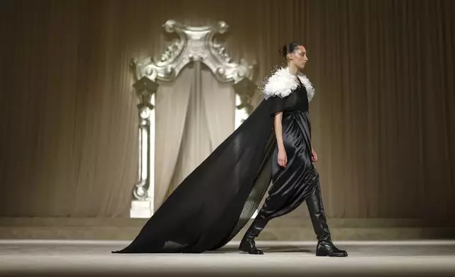 A model wears a creation as part of the Chanel Fall-Winter 2025/26 Haute Couture collection presented Tuesday, July 8, 2025, in Paris. (AP Photo/Tom Nicholson)