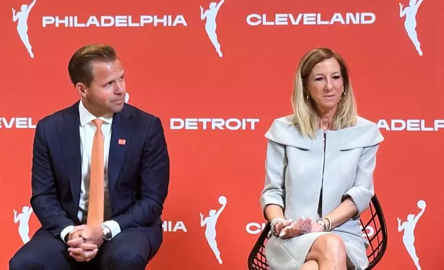 Nic Barlage, representing the Cleveland Cavaliers, and WNBA commissioner Cathy Engelbert listen during a news conference, Monday, June 30, 2025, in New York, announcing WNBA basketball expansion teams in Philadelphia, Detroit and Cleveland. (AP Photo/Doug Feinberg)