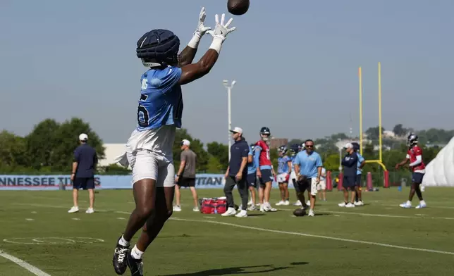 Tennessee Titans wide receiver Treylon Burks makes a catch during practice at the team's NFL football training camp Wednesday, July 23, 2025, in Nashville, Tenn. (AP Photo/George Walker IV)
