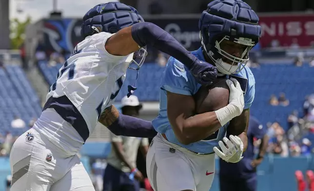 during "Back Together Weekend" at the team's NFL football training camp Saturday, July 26, 2025, in Nashville, Tenn. (AP Photo/George Walker IV)