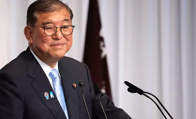 Japan's Prime Minister Shigeru Ishiba attends a press conference at the headquarters of the Liberal Democratic Party (LDP) in Tokyo Monday, July 21, 2025 after the prime minister's ruling coalition failed to secure a majority in the upper house in a parliamentary election. (Philip Fong/Pool Photo via AP)