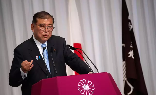 Japan's Prime Minister Shigeru Ishiba attends a press conference at the headquarters of the Liberal Democratic Party (LDP) in Tokyo Monday, July 21, 2025 after the prime minister's ruling coalition failed to secure a majority in the upper house in a parliamentary election. (Philip Fong/Pool Photo via AP)