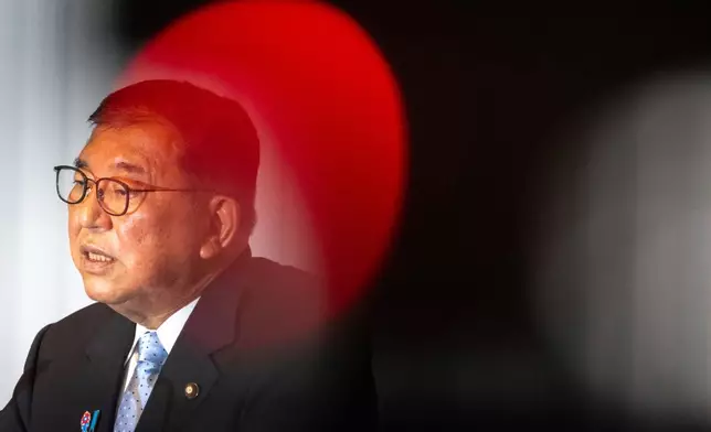 Japan's Prime Minister Shigeru Ishiba attends a press conference at the headquarters of the Liberal Democratic Party (LDP) in Tokyo Monday, July 21, 2025 after the prime minister's ruling coalition failed to secure a majority in the upper house in a parliamentary election. (Philip Fong/Pool Photo via AP)