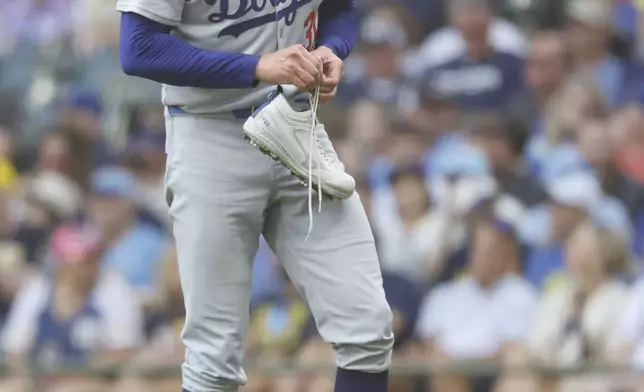 Los Angeles Dodgers starting pitcher Tyler Glasnow loses his shoe during the fifth inning of a baseball game against the Milwaukee Brewers, Wednesday, July 9, 2025, in Milwaukee. (AP Photo/Jeffrey Phelps)