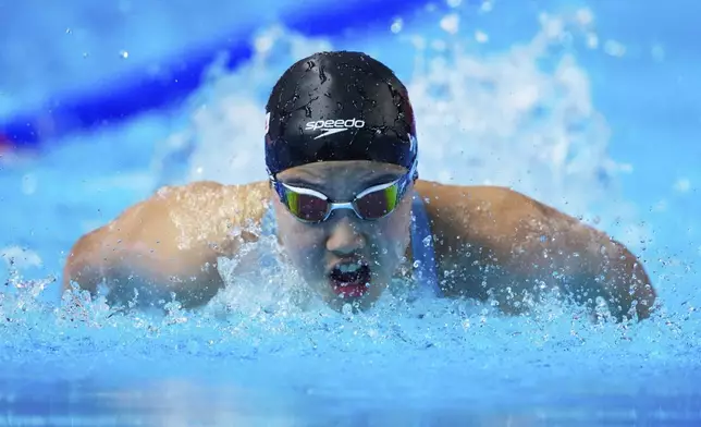 Yu Zidi of China competes in the women's 200-meter individual medley heat at the World Aquatics Championships in Singapore, Sunday, July 27, 2025. (AP Photo/Vincent Thian)