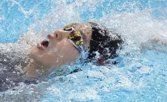 Yu Zidi of China competes in the women's 200-meter individual medley heat at the World Aquatics Championships in Singapore, Sunday, July 27, 2025. (AP Photo/Lee Jin-man)