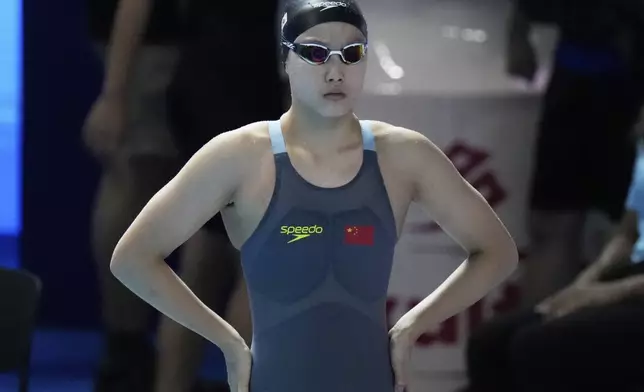 Yu Zidi of China prepares to compete in the women's 200-meter individual medley heat at the World Aquatics Championships in Singapore, Sunday, July 27, 2025. (AP Photo/Lee Jin-man)