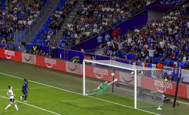 Germany's goalkeeper Ann-Katrin Berger makes a save during the Women's Euro 2025 quarterfinals soccer match between France and Germany at St. Jakob-Park in Basel, Switzerland, Saturday, July 19, 2025. (Michael Buholzer/Keystone via AP)