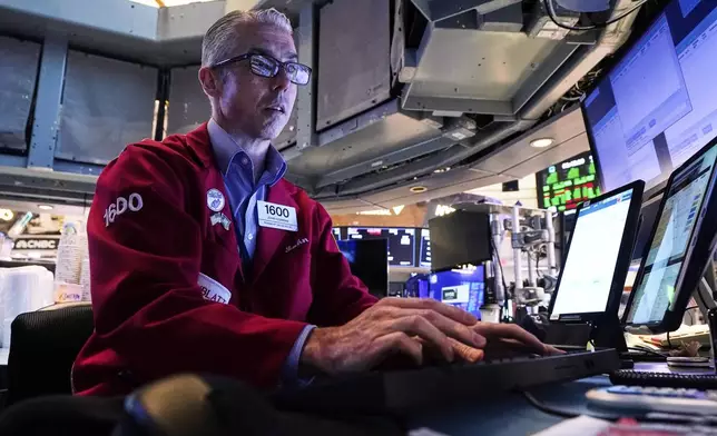 Trader John Gorman works on the floor of the New York Stock Exchange, Monday, July 21, 2025. (AP Photo/Richard Drew)
