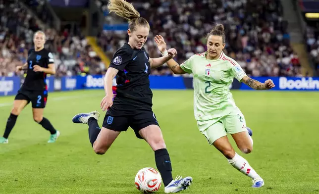 England's Keira Walsh, left, and Italy's Elisabetta Oliviero in action during the Women's Euro 2025 semifinal soccer match between England and Italy at Stade de Geneve in Geneva, Switzerland, Tuesday, July 22, 2025. (Jean-Christophe Bott/Keystone via AP)