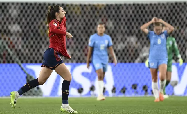FILE - Spain's Olga Carmona, left, celebrates after scoring the opening goal during the Women's World Cup soccer final between Spain and England at Stadium Australia in Sydney, Australia, Sunday, Aug. 20, 2023. (AP Photo/Steve Markham, File)