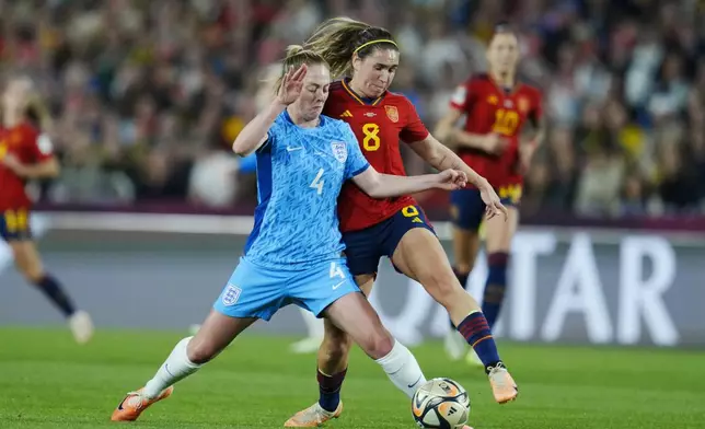 FILE - England's Keira Walsh, left, vies for the ball with Spain's Mariona Caldentey during the Women's World Cup soccer final between Spain and England at Stadium Australia in Sydney, Australia, Sunday, Aug. 20, 2023. (AP Photo/Abbie Parr, File0