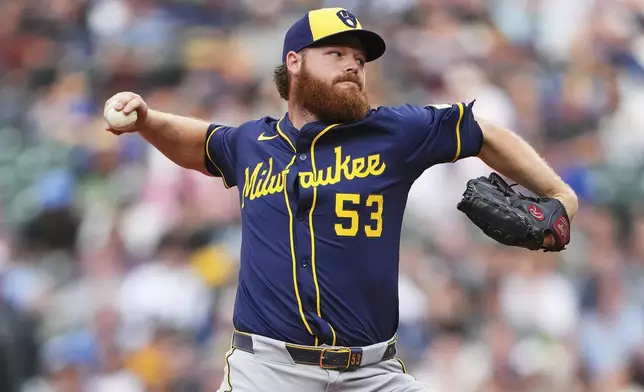 Milwaukee Brewers starting pitcher Brandon Woodruff throws against the Seattle Mariners during the fourth inning of a baseball game Monday, July 21, 2025, in Seattle. (AP Photo/Lindsey Wasson)