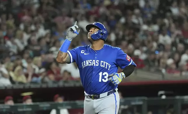 Kansas City Royals'Salvador Perez looks up as he rounds the bases after hitting a home run against the Arizona Diamondbacks during the fourth inning of a baseball game Sunday, July 6, 2025, in Phoenix. (AP Photo/Ross D. Franklin)