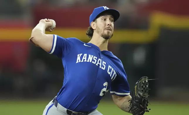 Kansas City Royals starting pitcher Michael Lorenzen throws against the Arizona Diamondbacks during the first inning of a baseball game Sunday, July 6, 2025, in Phoenix. (AP Photo/Ross D. Franklin)