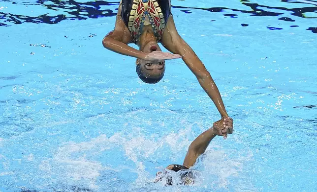 Team Egypt compete in the team acrobatic preliminary of artistic swimming at the World Aquatics Championships in Singapore, Thursday, July 24, 2025. (AP Photo/Ng Han Guan)