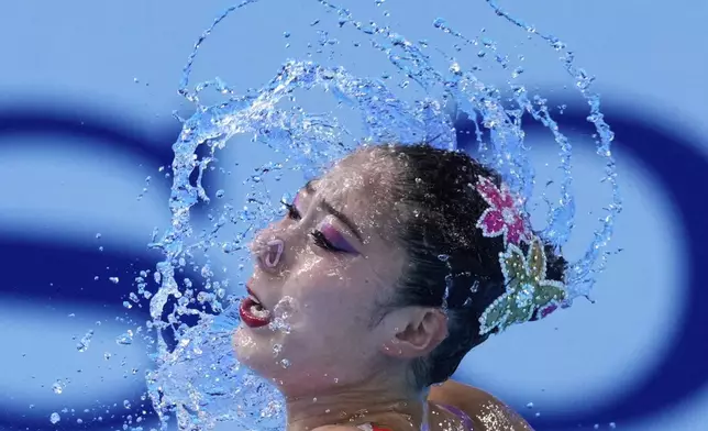 Moe Higa of Japan competes during the women's solo technical at the World Aquatics Championships in Singapore, Saturday, July 19, 2025. (AP Photo/Vincent Thian)