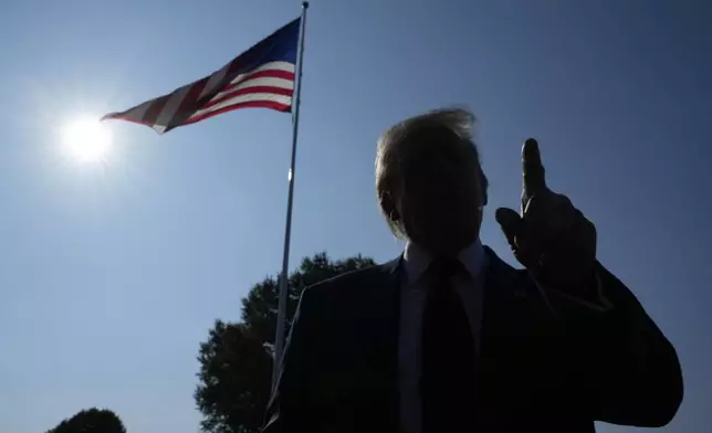 President Donald Trump speaks with reporters before departing on Marine One from the South Lawn of the White House, Friday, July 25, 2025, in Washington. The President is traveling to Scotland. (AP Photo/Alex Brandon)
