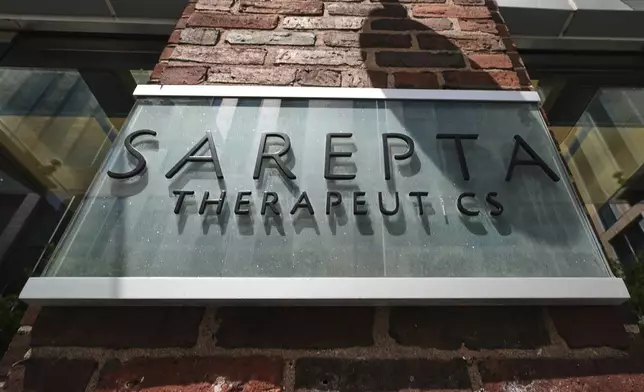 The name and logo of Sarepta Therapeutics is displayed on the company's headquarters, Monday, July 28, 2025, in Cambridge, Mass. (AP Photo/Charles Krupa)