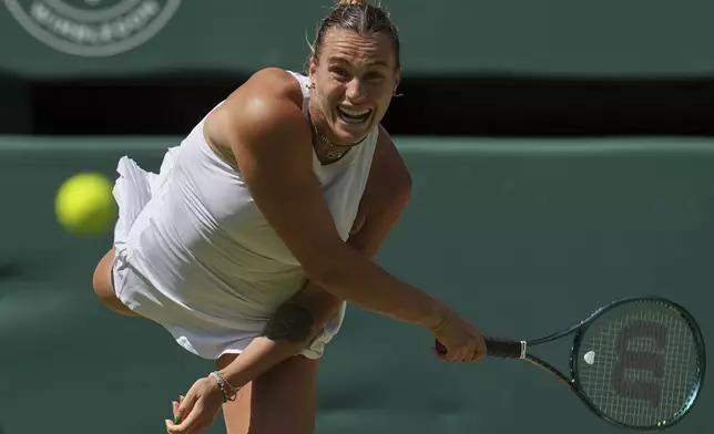 Aryna Sabalenka of Belarus serves to Amanda Anisimova of the U.S. during a women's singles semifinal match at the Wimbledon Tennis Championships in London, Thursday, July 10, 2025. (AP Photo/Kin Cheung)