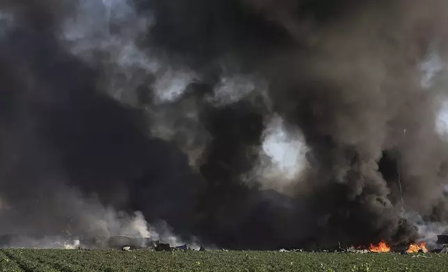 Smoke and flames rise during a fireworks warehouse explosion near Esparto, Calif., Tuesday, July 1, 2025. (Kent Porter/The Press Democrat via AP)