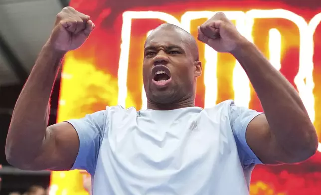 Britain's Daniel Dubois warms up during a public workout at BoxPark near Wembley stadium in London, Wednesday, July 16, 2025 ahead of the undisputed heavyweight champion boxing fight between Britain's Daniel Dubois and Ukraine's boxer Oleksandr Usyk on Saturday. (AP Photo/Kirsty Wigglesworth)