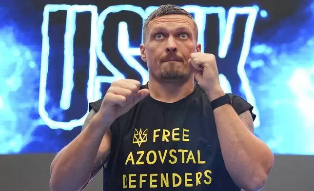 Ukraine's boxer Oleksandr Usyk warms up during a public workout at BoxPark near Wembley stadium in London, Wednesday, July 16, 2025 ahead of the undisputed heavyweight champion boxing fight between Britain's Daniel Dubois and Oleksandr Usyk on Saturday. (AP Photo/Kirsty Wigglesworth)